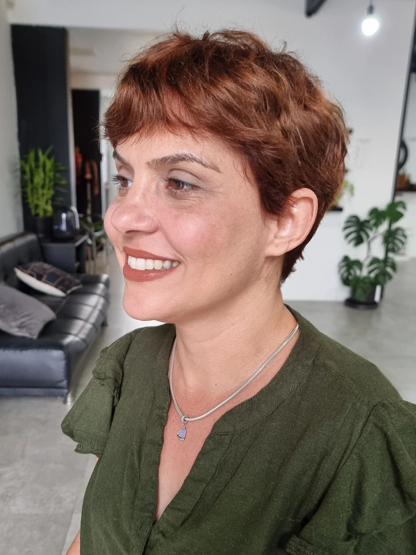 Copper pixie with short textured fringe and tapered back.