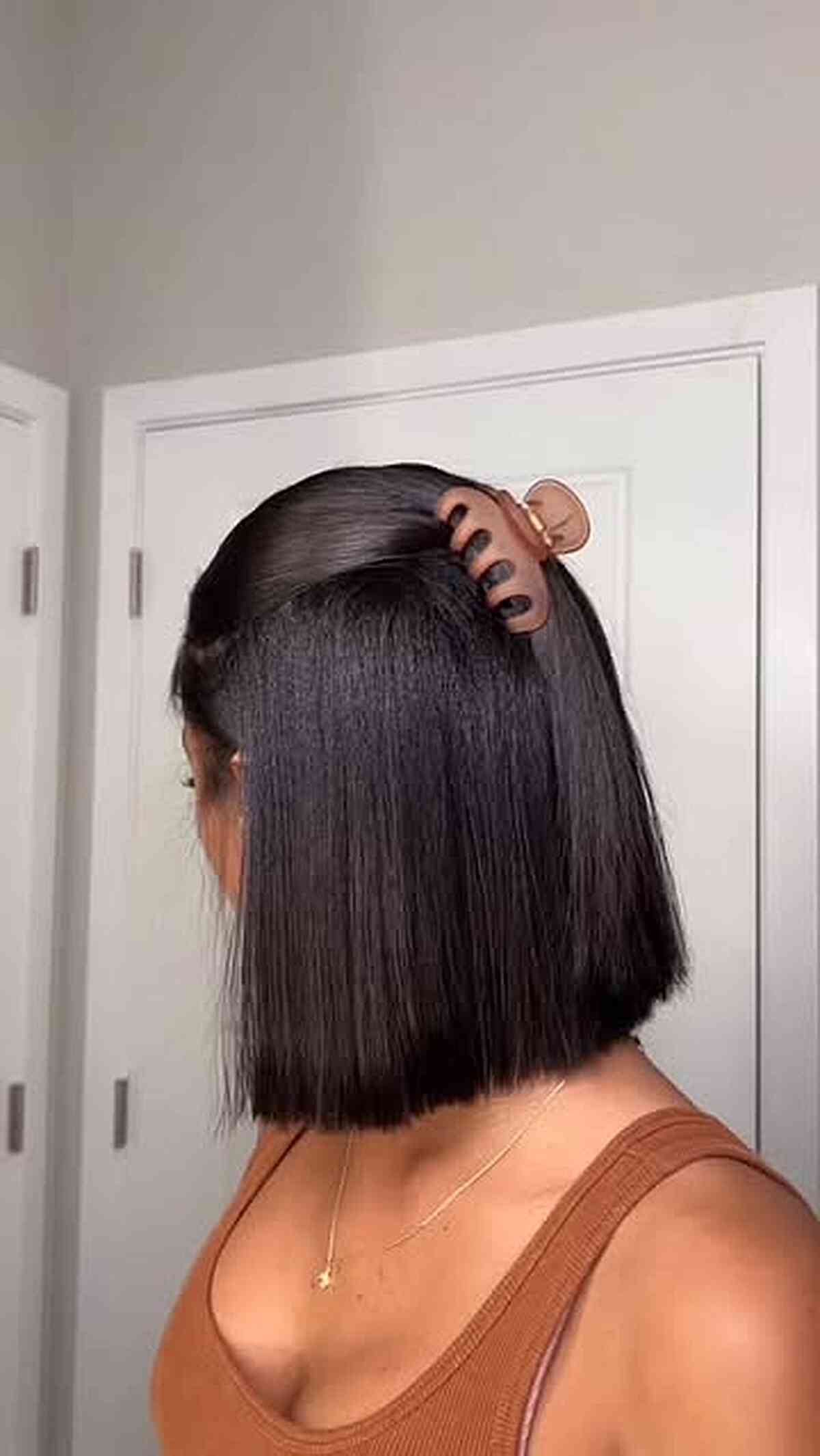 Straight chin-length bob clipped back at the crown.