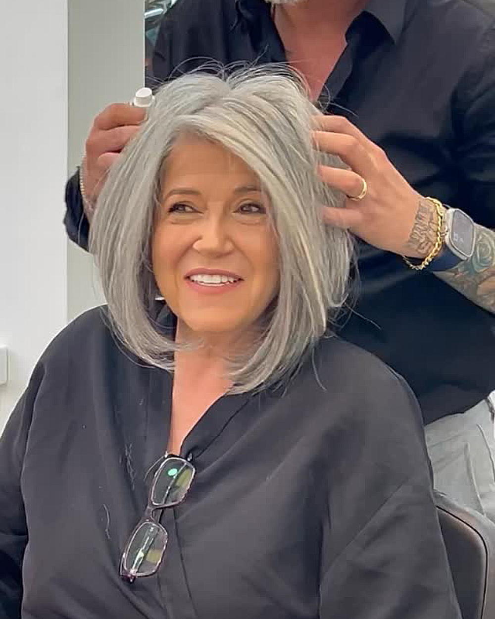 Voluminous silver bob with layered sides and curved ends.