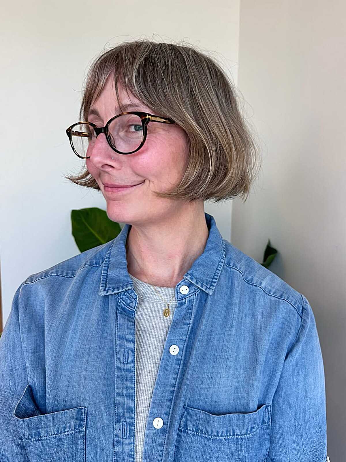 Ash blonde chin-length bob with a soft side part and light fringe