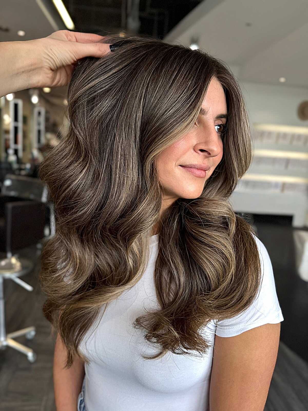 Long brown waves with subtle mushroom lowlights and volume.