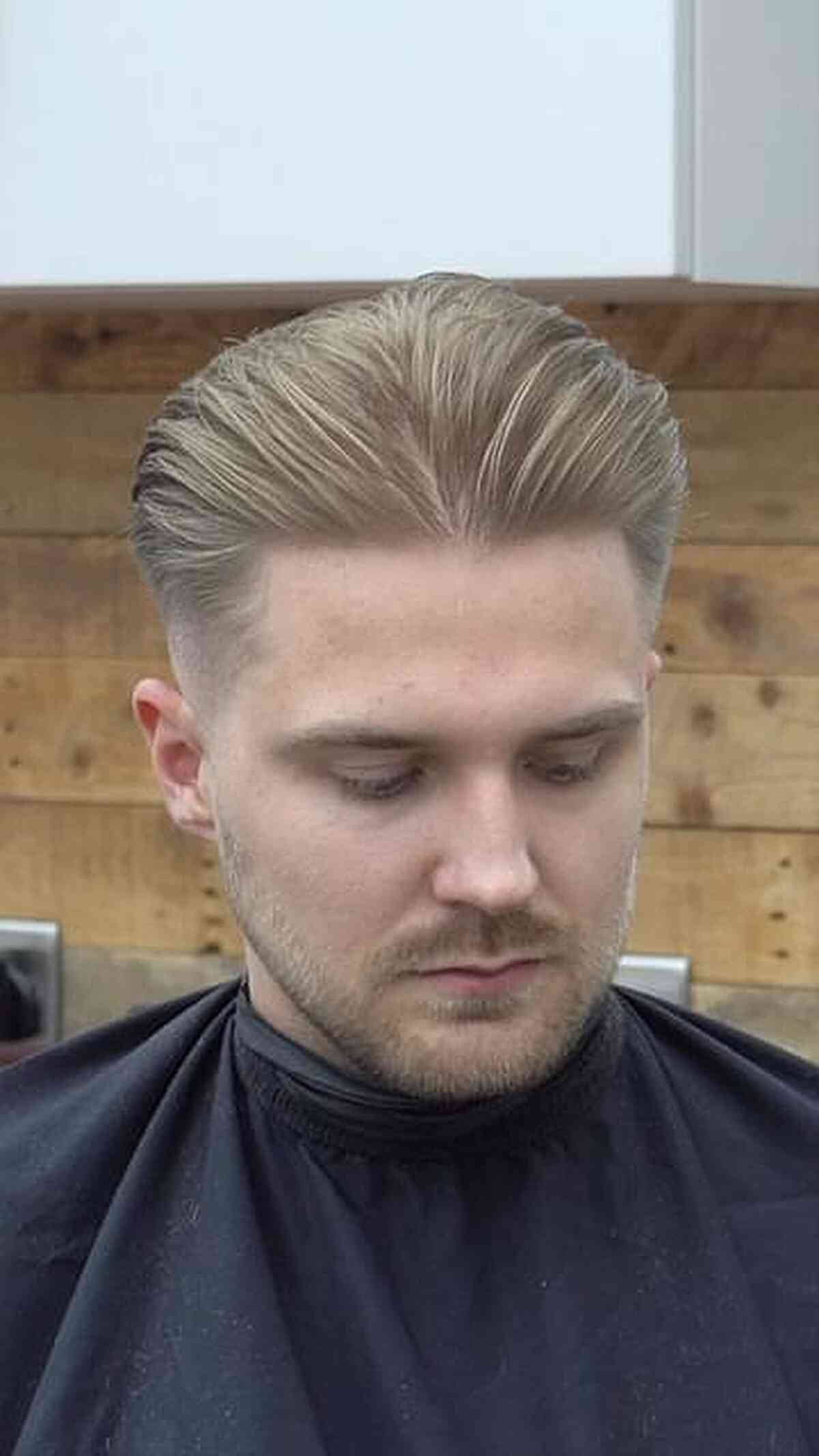 Slicked-back blond top with faded sides