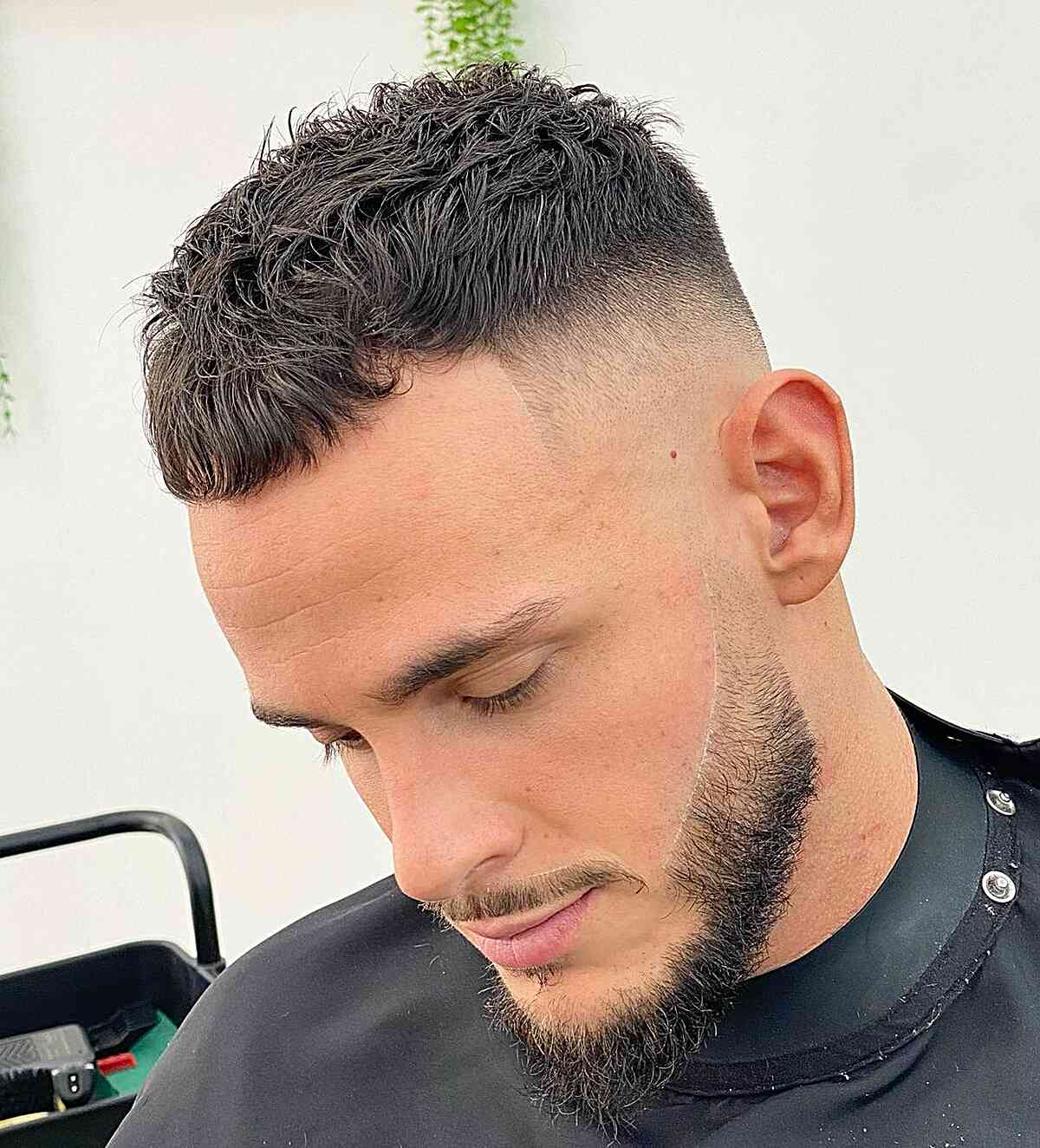 Short crop with textured fringe and a skin fade.