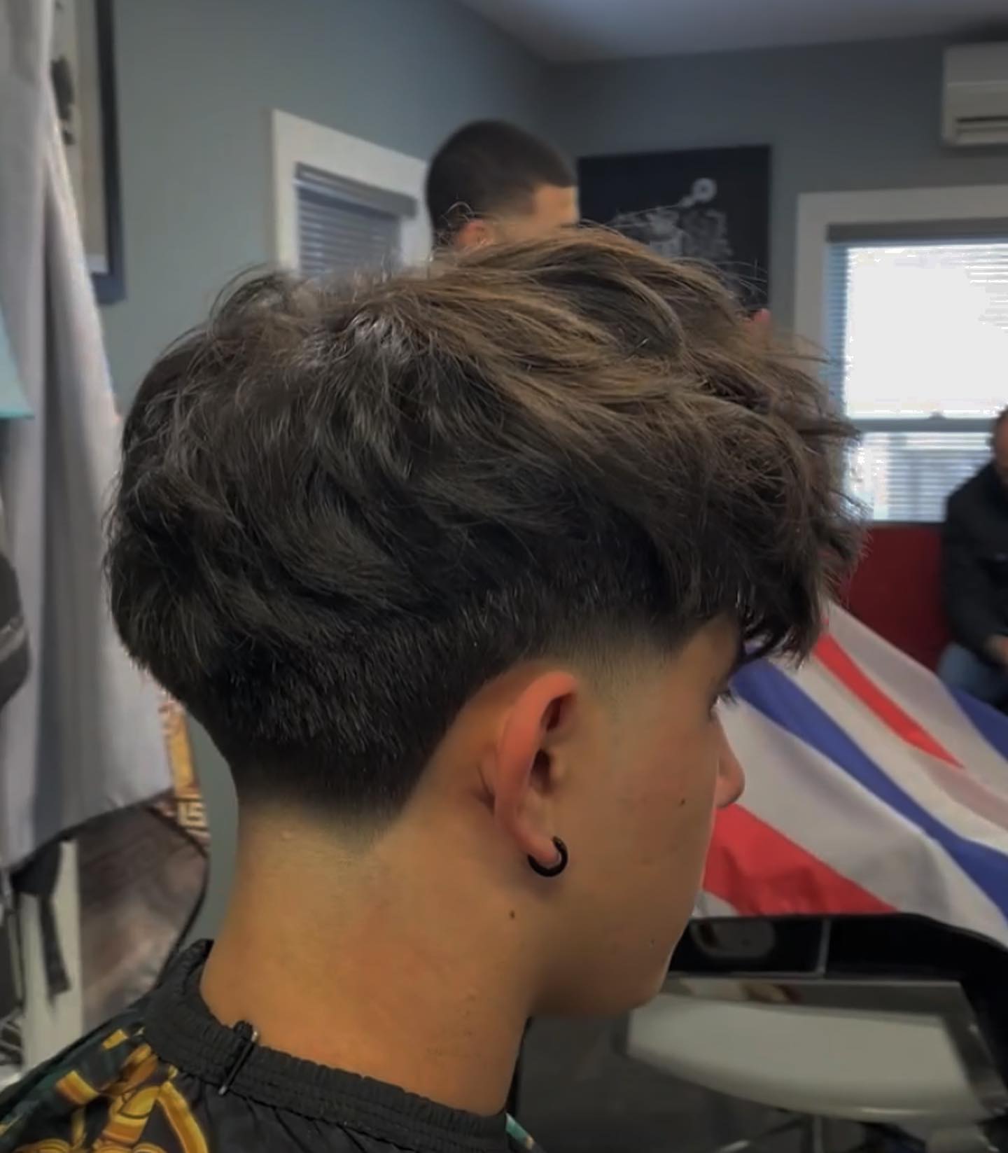 Messy medium top with low fade and fuller crown.