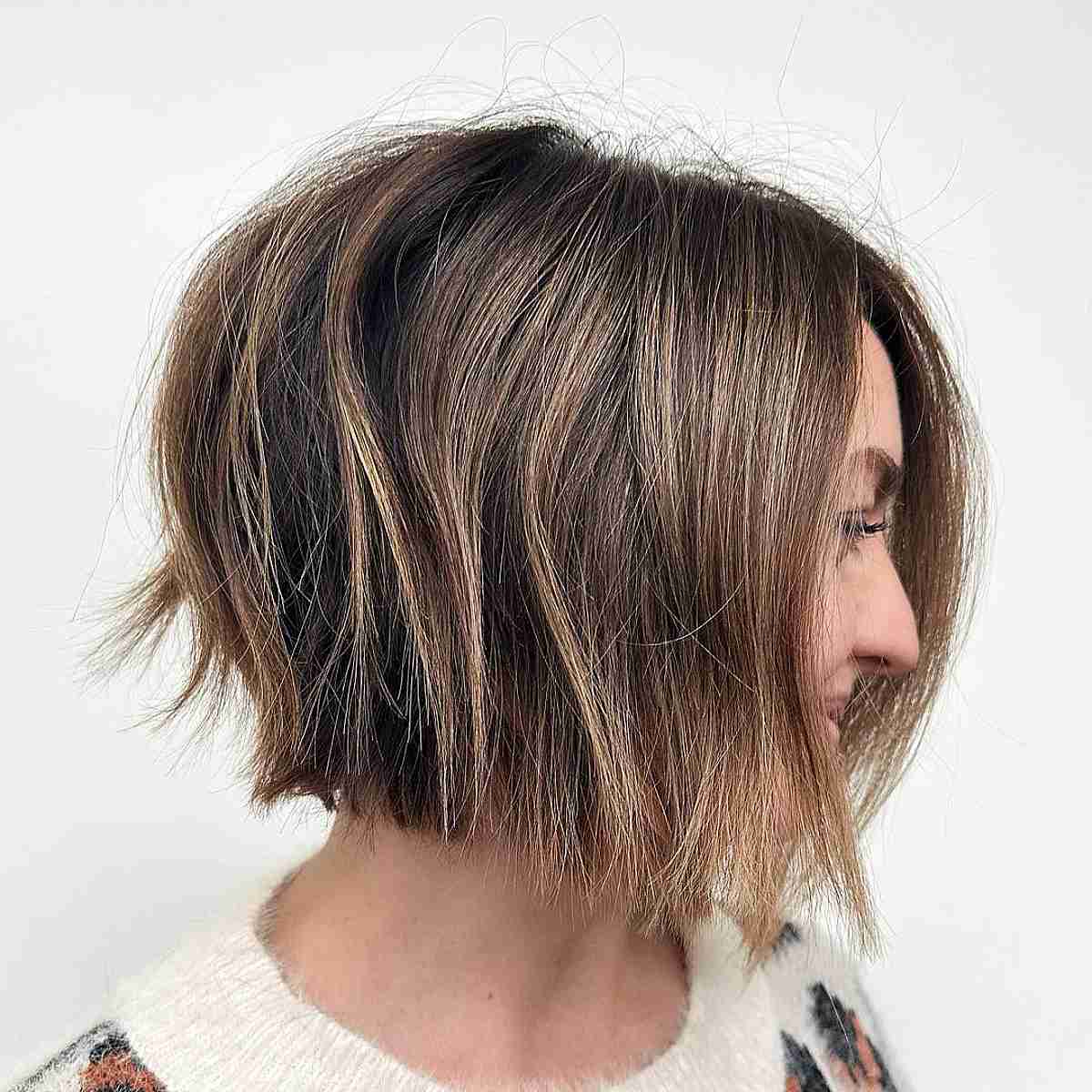 Textured angled bob with brown and blonde dimension and bounce.