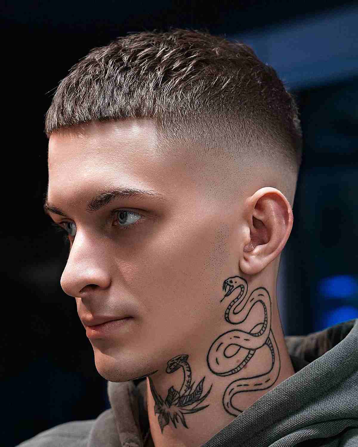 Blunt short crop with a tight skin fade and straight fringe.
