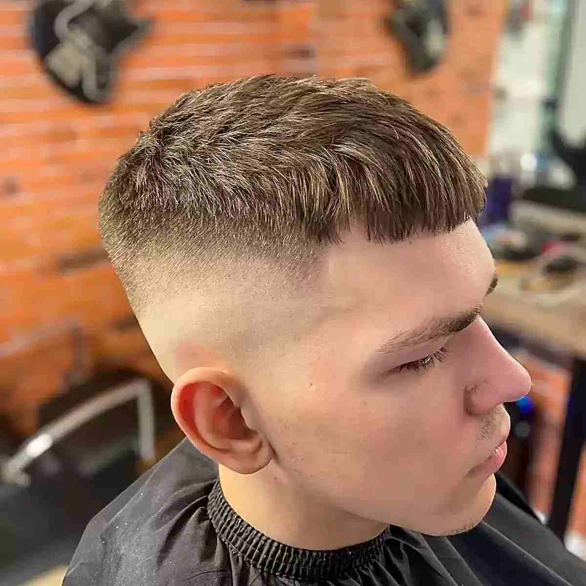 Very short fringe with a high fade and cropped textured top.