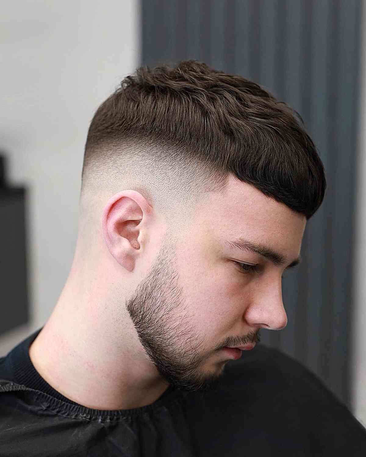 Short Caesar crop with forward fringe and closely shaved sides.