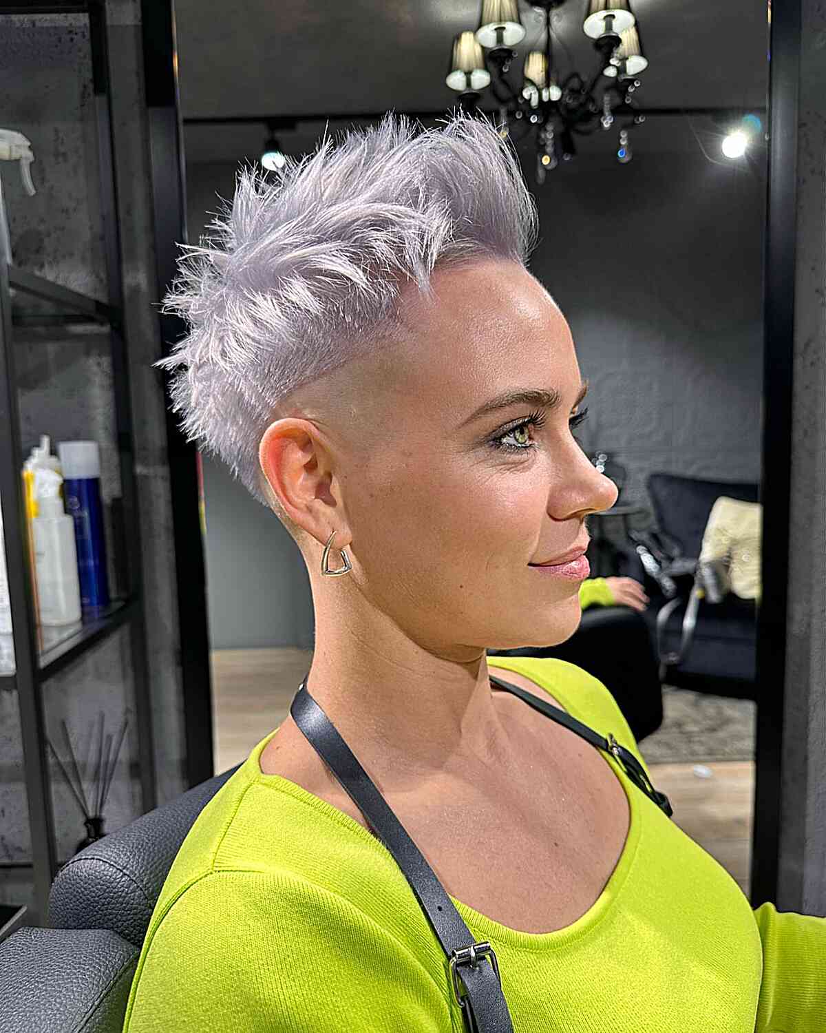 Spiky silver pixie with shaved sides and tall crown.