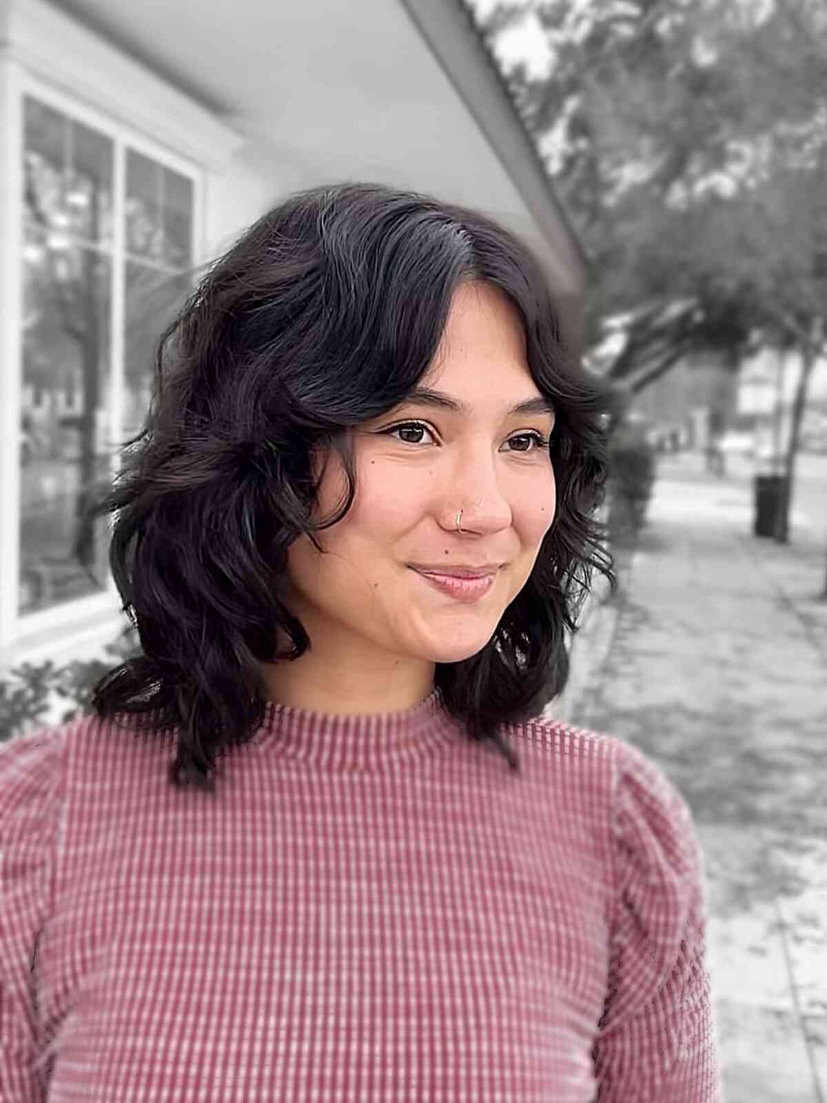 Short wavy lob with layers and soft fringe.