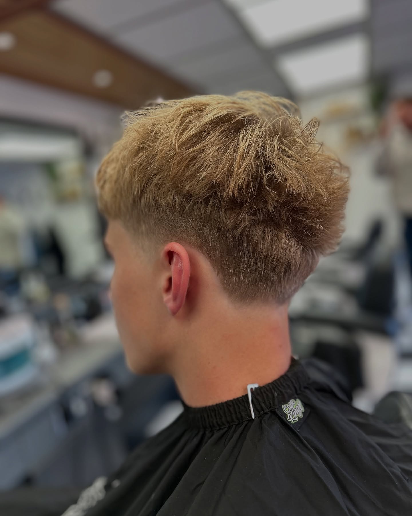 Blown-out layered top with tapered sides and back.