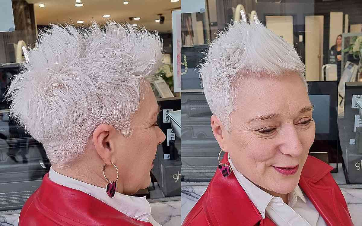 White-blonde mohawk-inspired pixie with tall top and short sides.