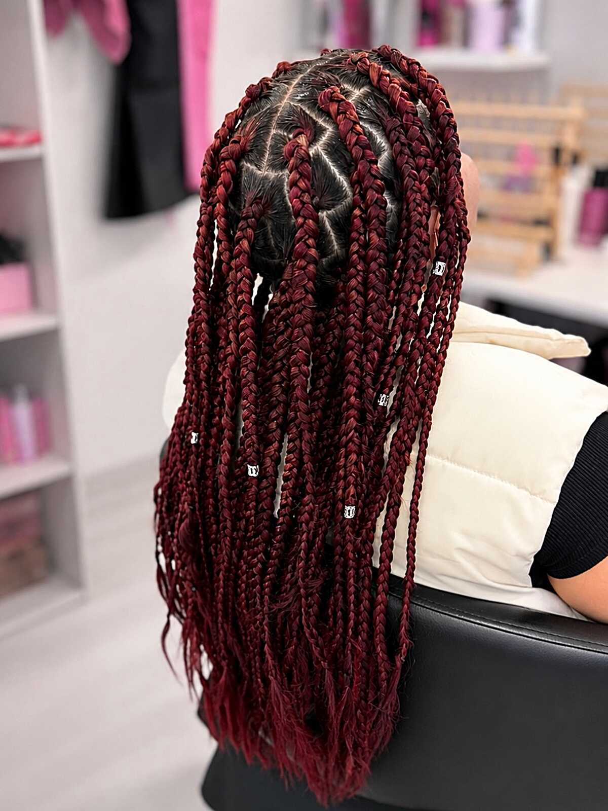 Burgundy knotless braids with triangle parting and cuffs