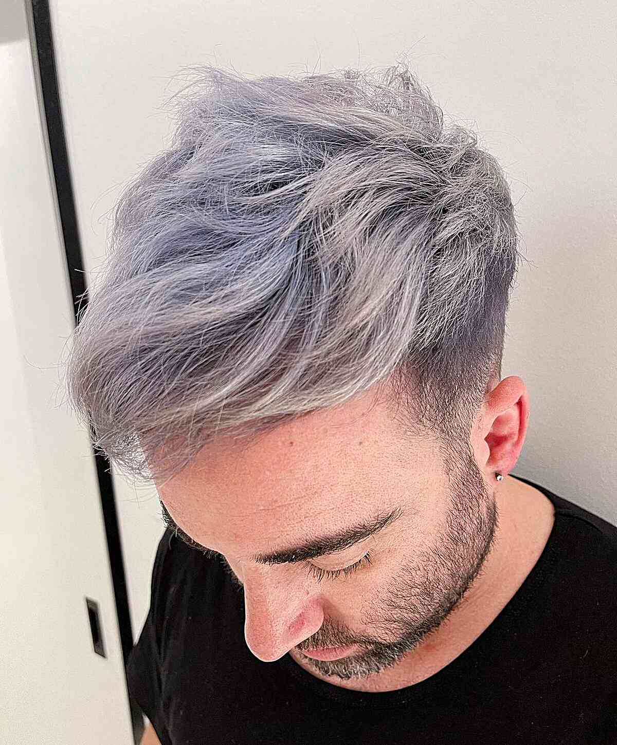 Forward-styled silver-lavender hair with undercut sides