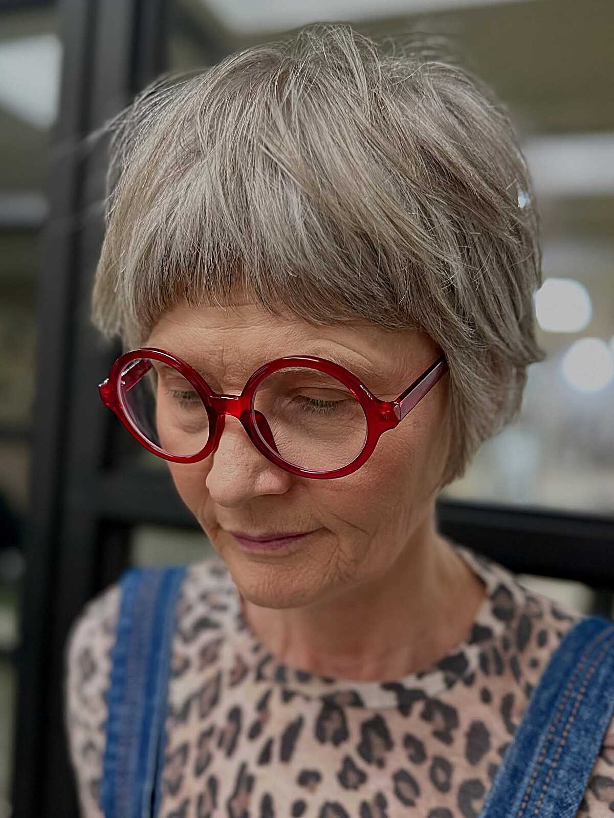 Soft gray crop with textured fringe and rounded shape.
