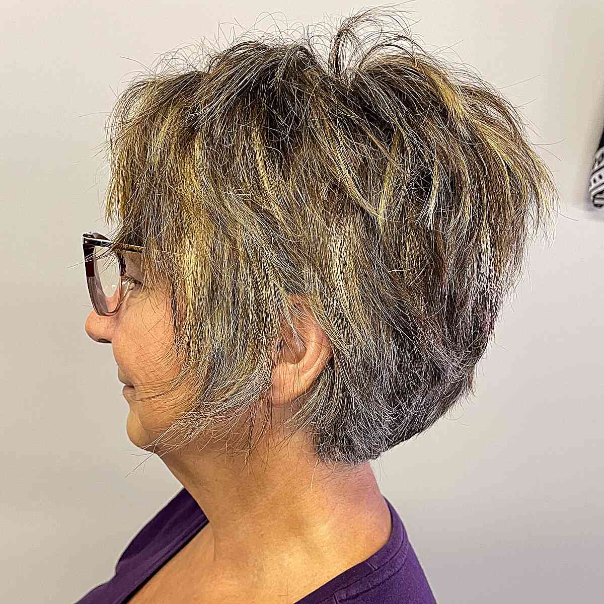 Choppy short pixie bob with textured top and tapered nape.