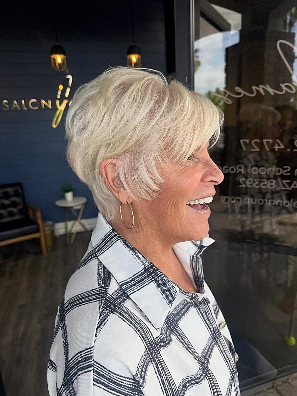 Platinum pixie with stacked back and feathered ear coverage.