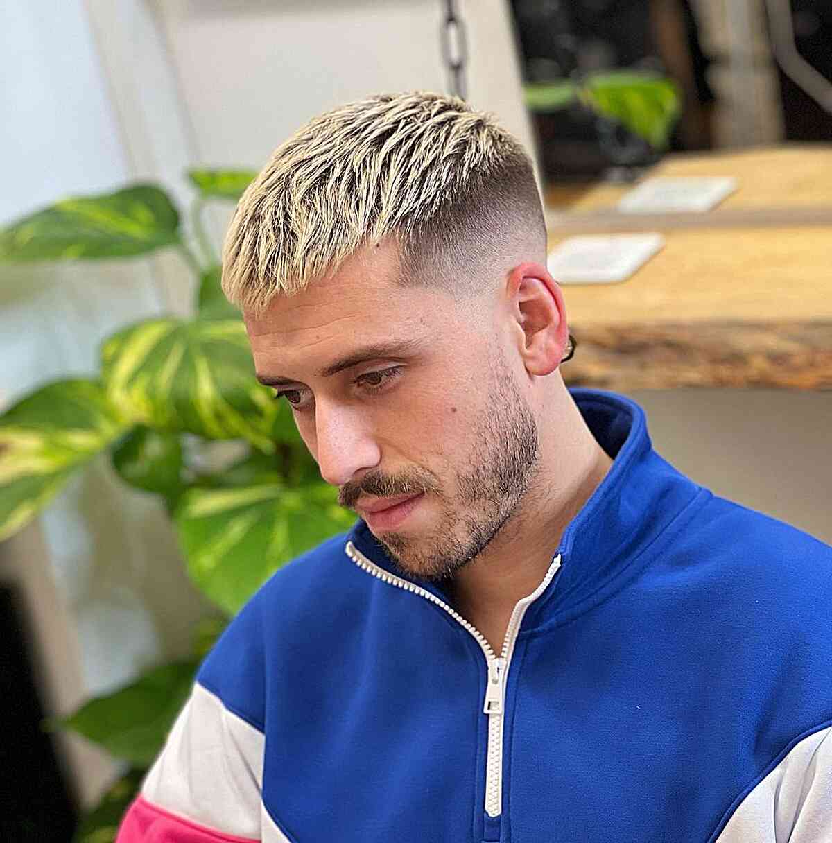 Blonde textured crop with a sharp disconnect and faded sides.