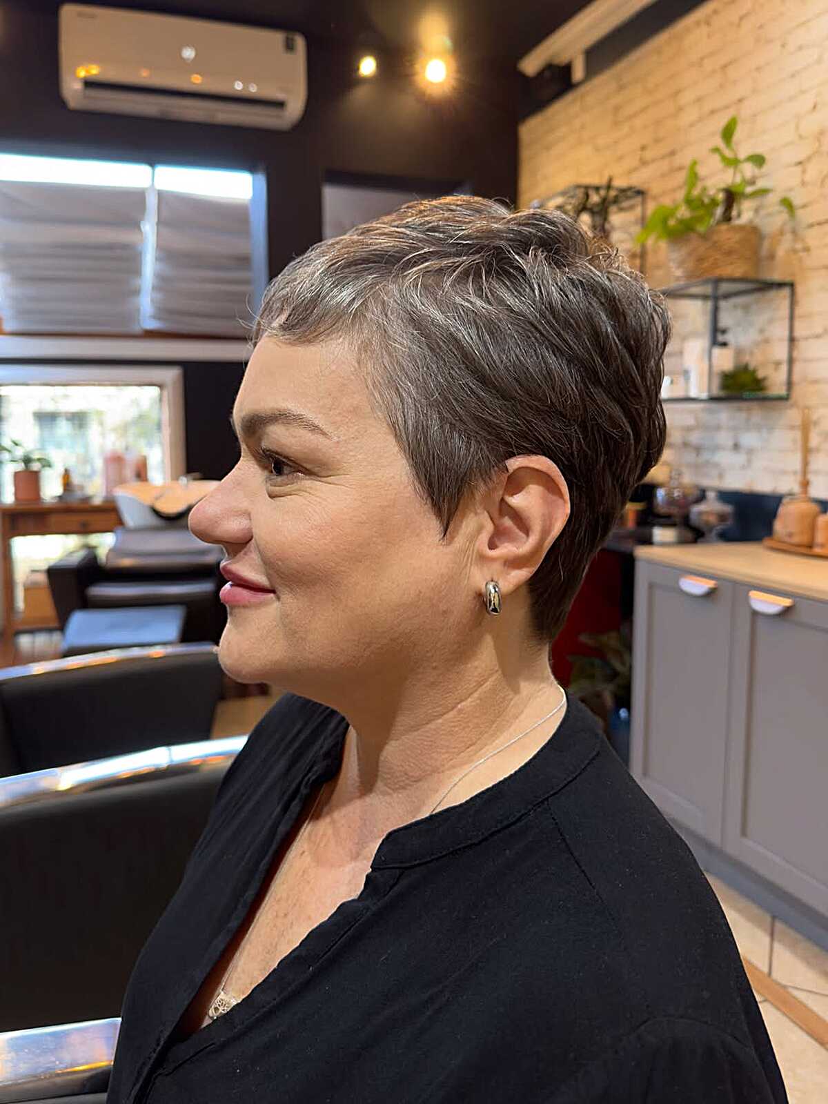 Gray-blend pixie with brushed-back top and tapered sides.