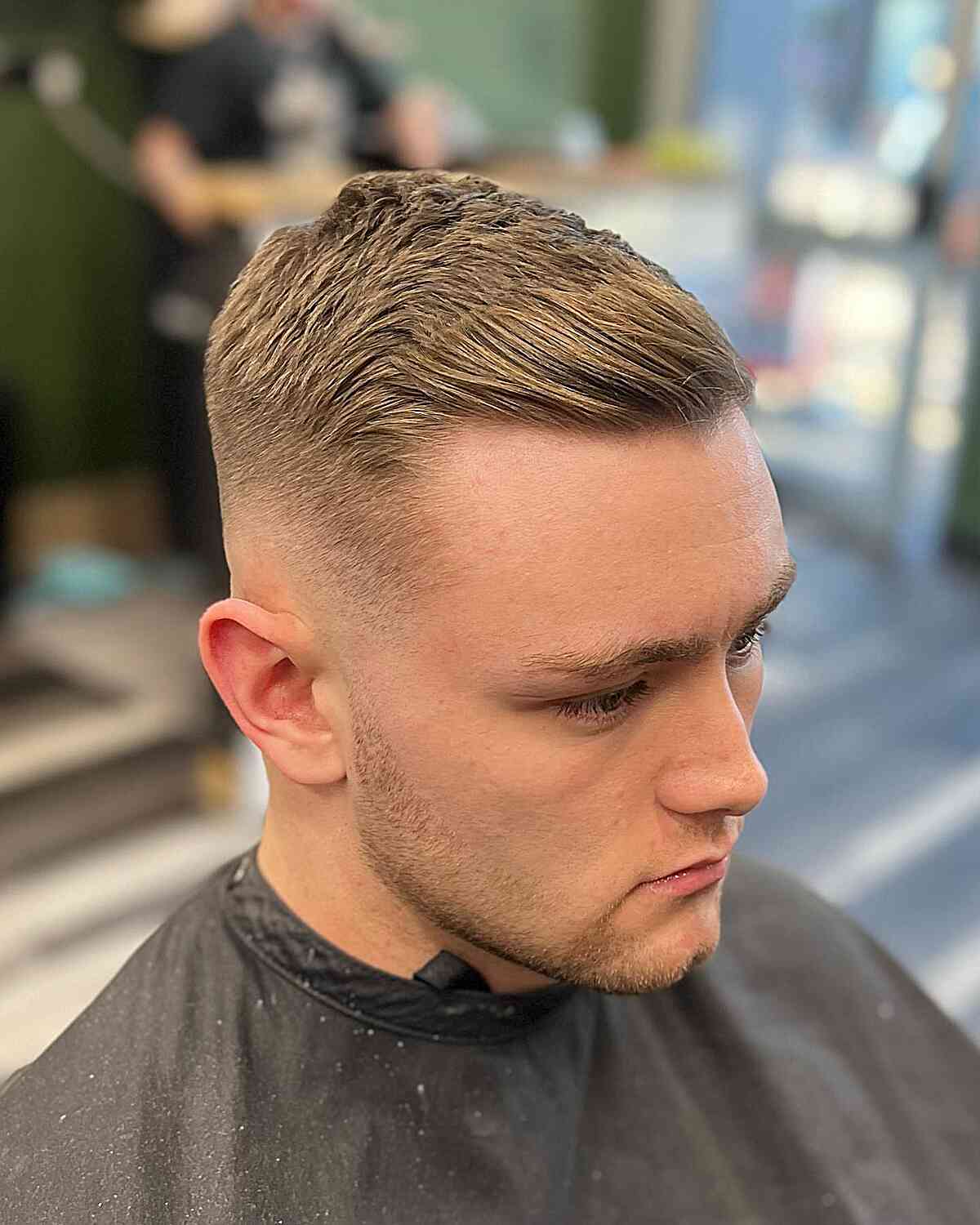 Blonde short top with faded sides and side-swept texture.