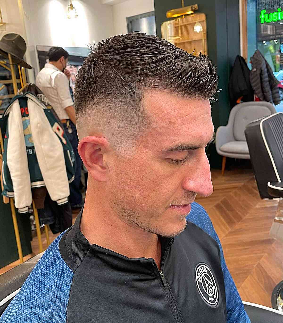 Crew cut with high skin fade and short textured top.