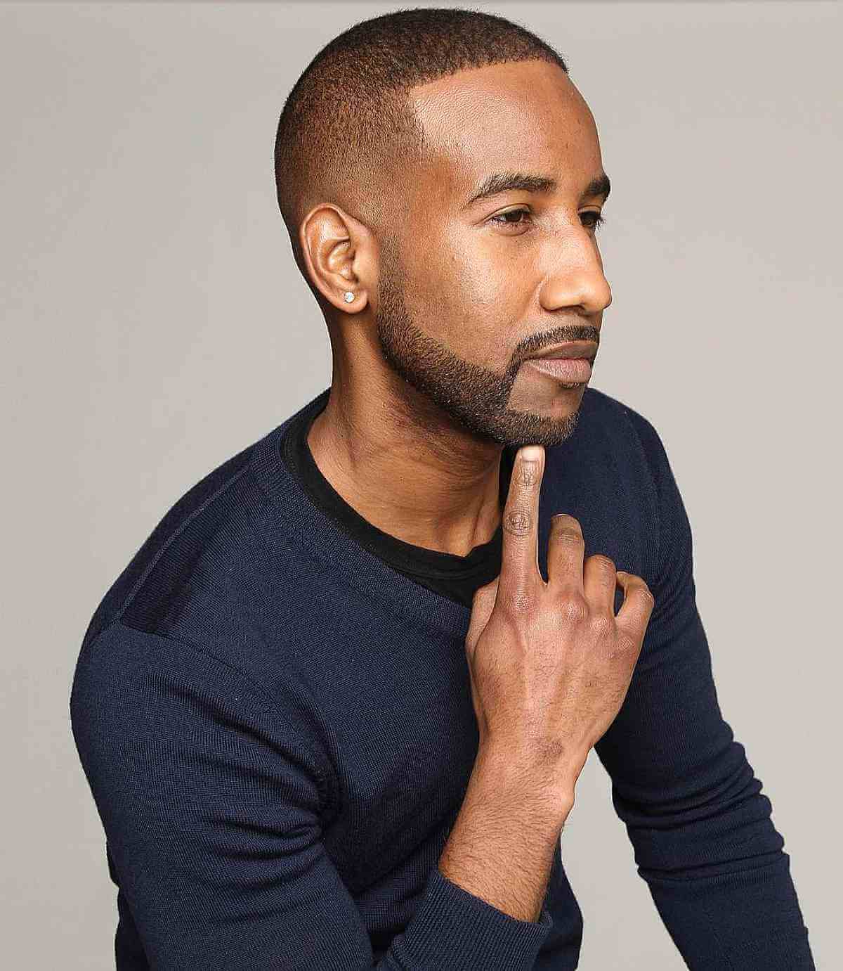 Short even crop with closely faded sides and a straight hairline.