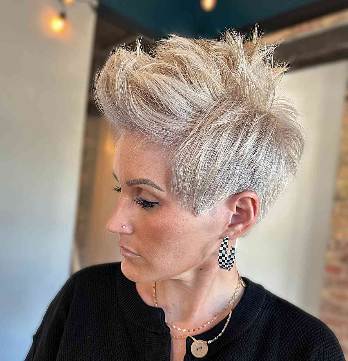 Platinum pixie with a lifted quiff and short sides.