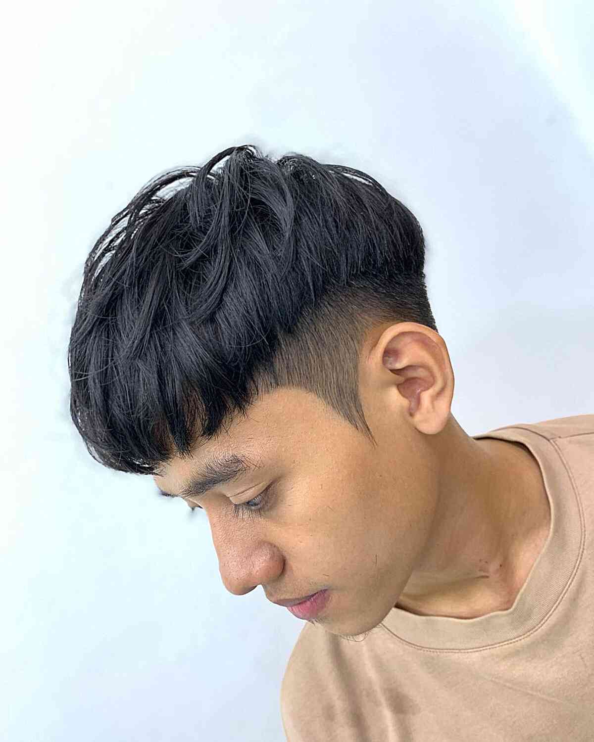 Tousled short crop with forward fringe and faded sides.