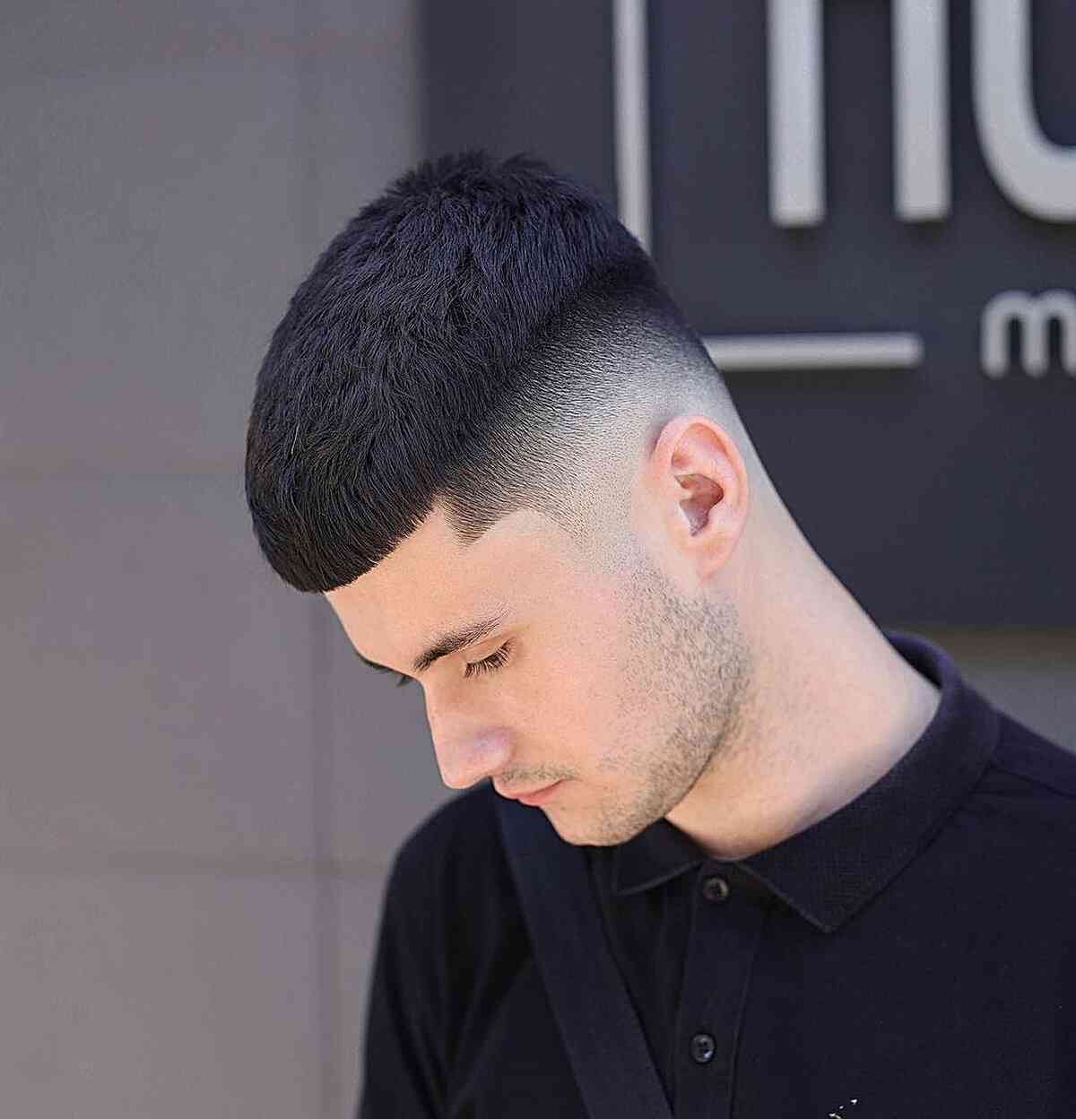 Dark short fringe cut with a smooth fade and neat top.