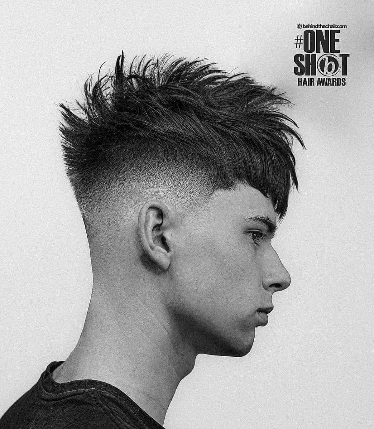 Short spiky haircut with faded sides and a textured top.