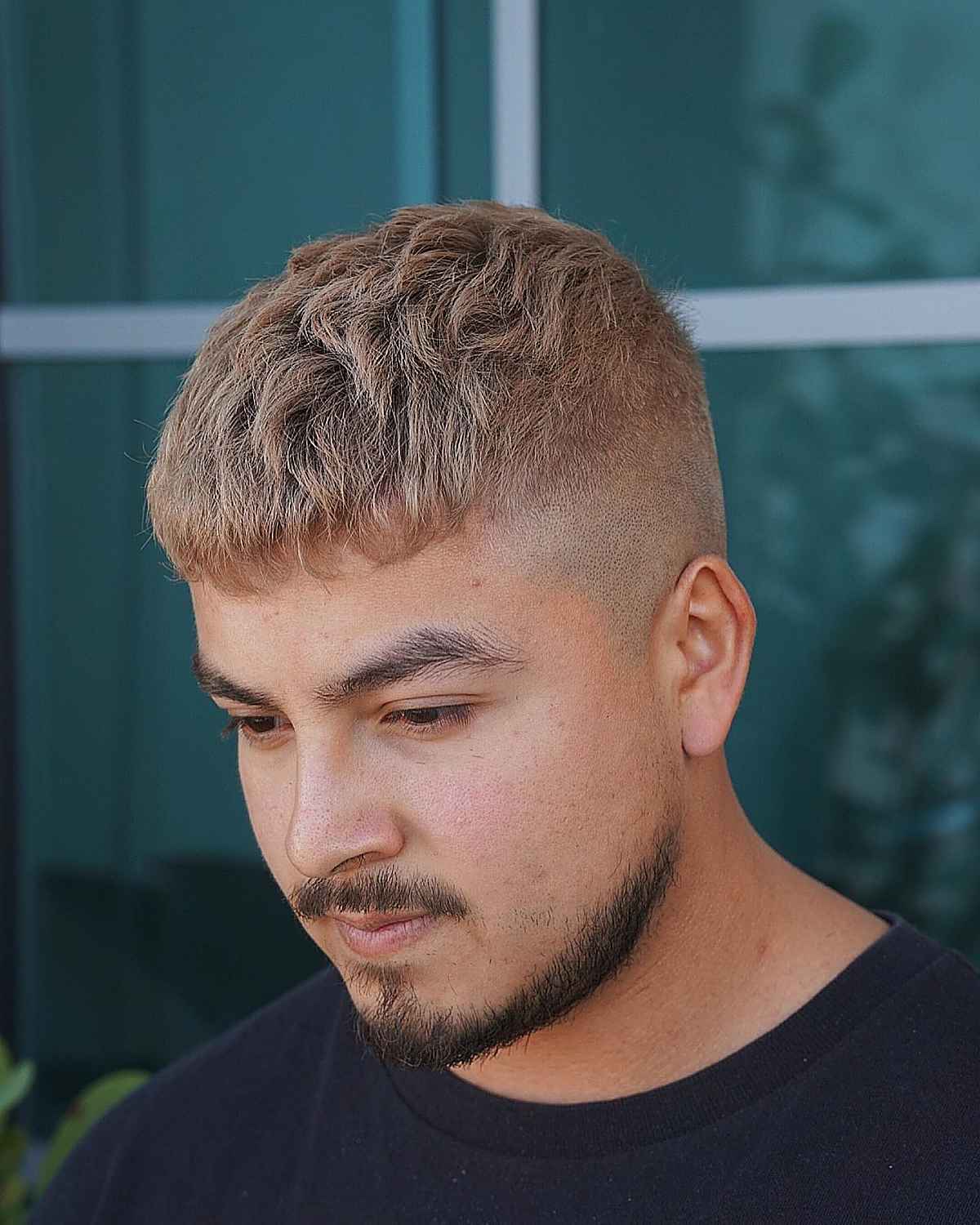 Short textured Caesar with blunt fringe and faded sides.
