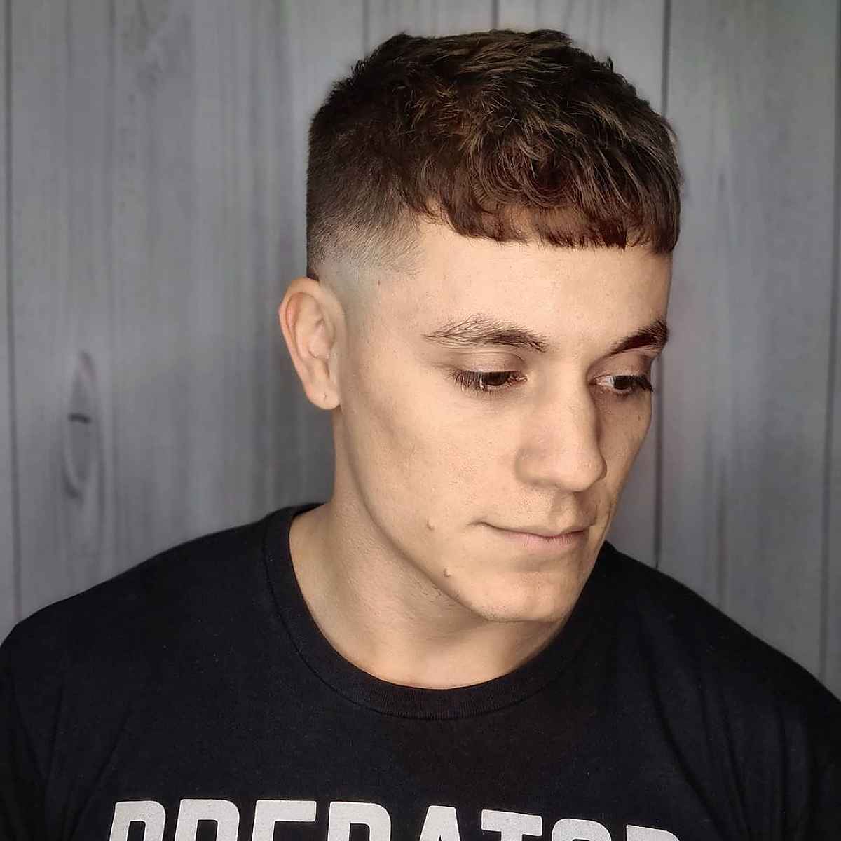 Short boxed fringe cut with close faded sides.
