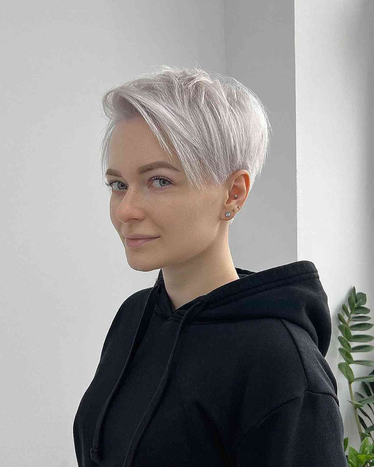 Platinum pixie with angled side sweep and tapered cut.
