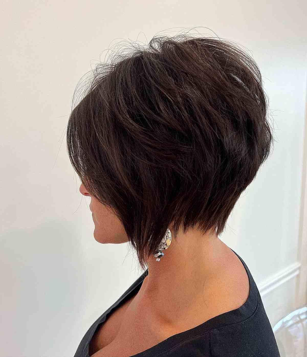 Dark brown inverted angled bob with a rounded back and sharp front.