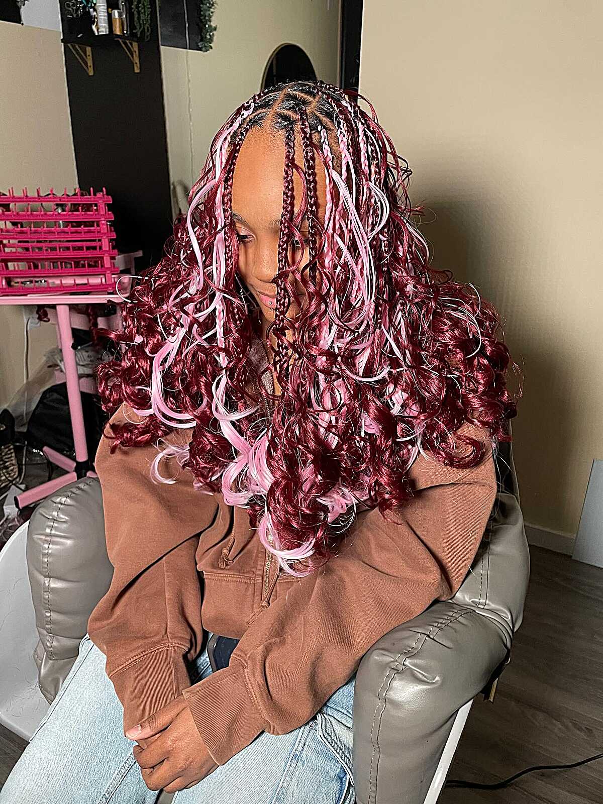 Burgundy and pink box braids with loose voluminous curls