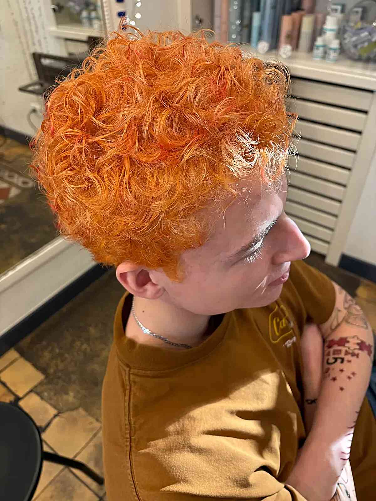 Short curly crop in bright orange