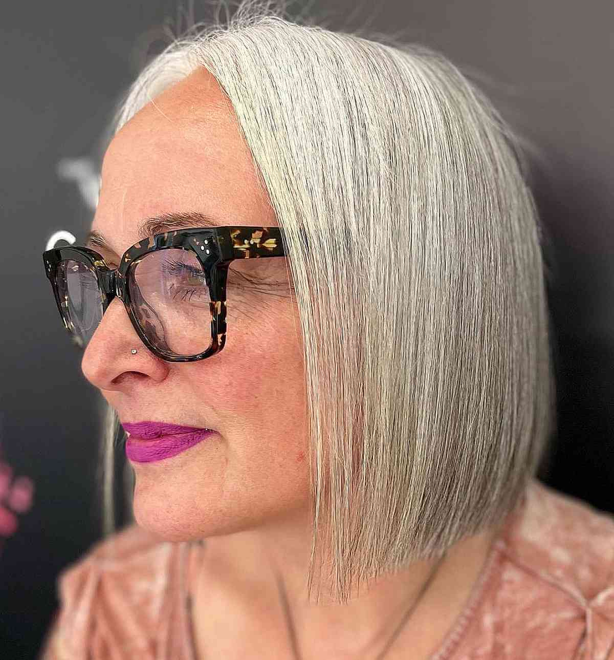 Rounded bob with a tapered nape and smooth finish.