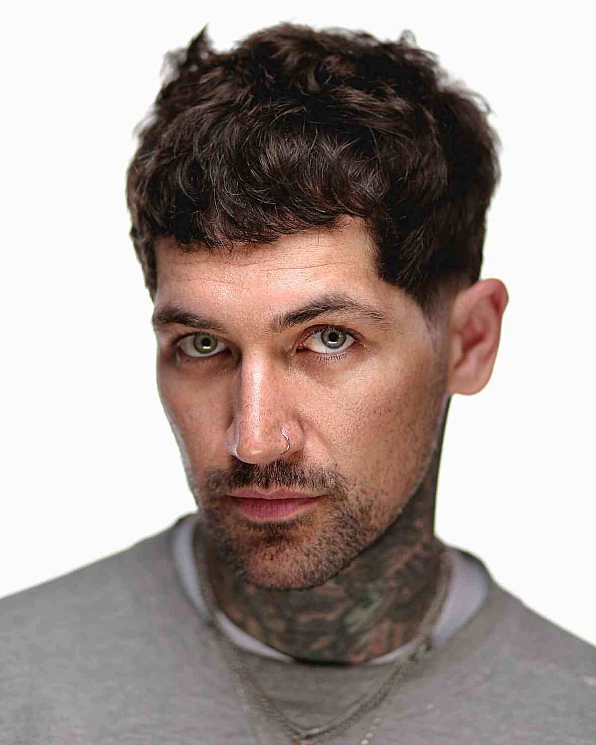 Short angular cut with choppy fringe and close faded sides.
