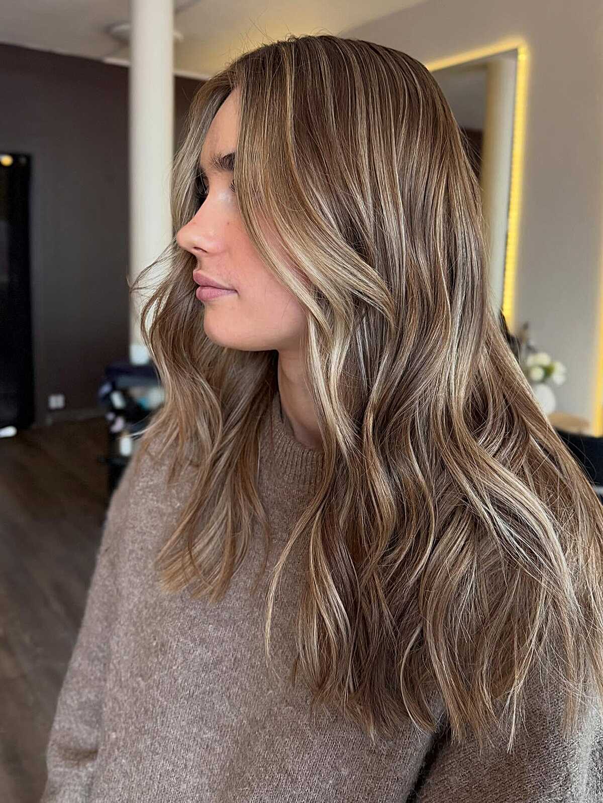 Long bronde waves with thin blonde and brown ribbons.